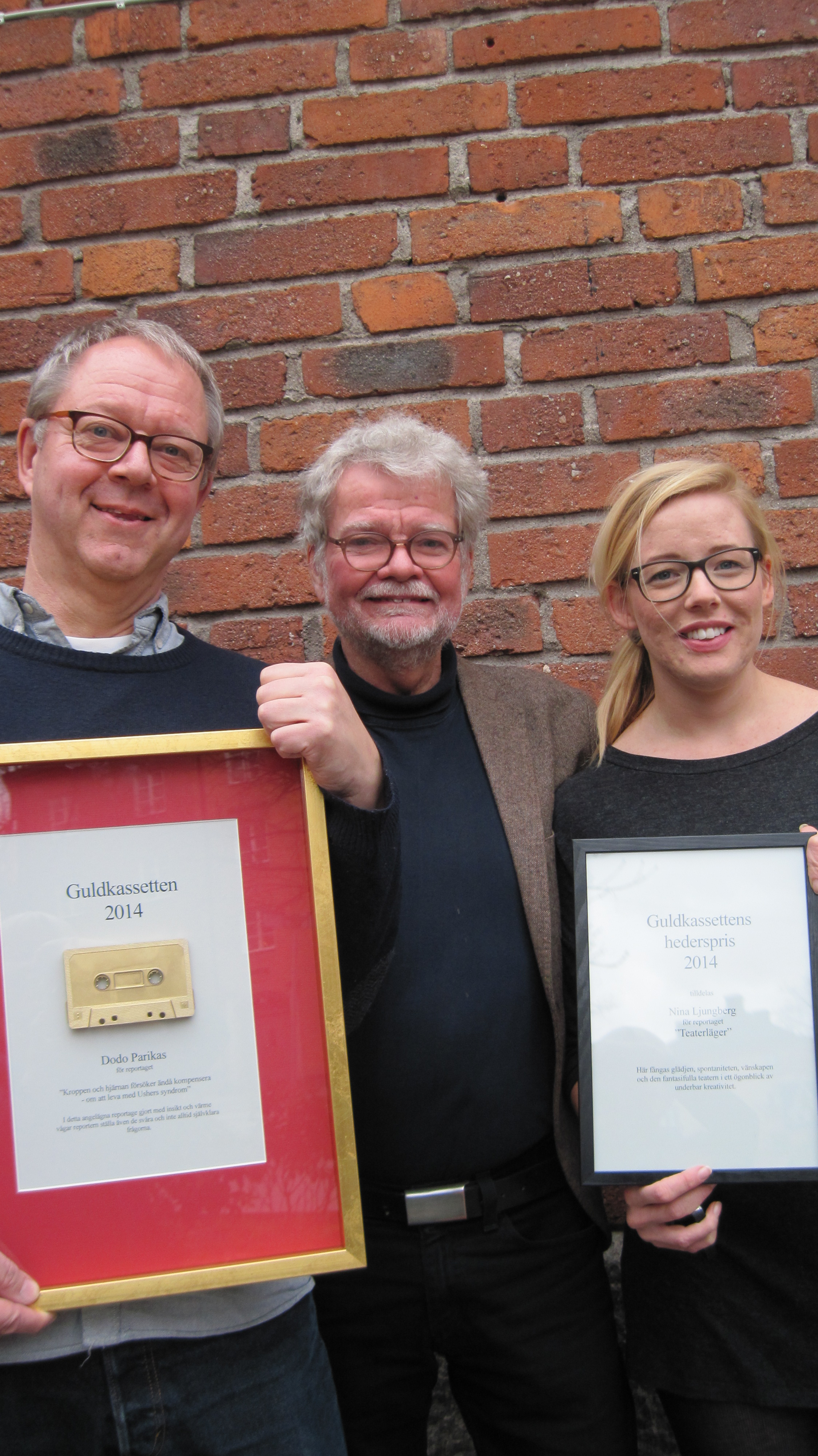 Dodo Parikas, Martin Dyfverman, Nina Ljungberg.Dodo och Nina håller sina pristavlor framför sig. Dodo har gråblont hår och mörkblå tröja. Nina har blont hår i bena och svart båtringad topp. Martin har gråvitt hår och skägg, samt ljusbrun kavaj och blå tröja.